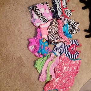 7 toddler 2T swimsuits and 1 2T coverup